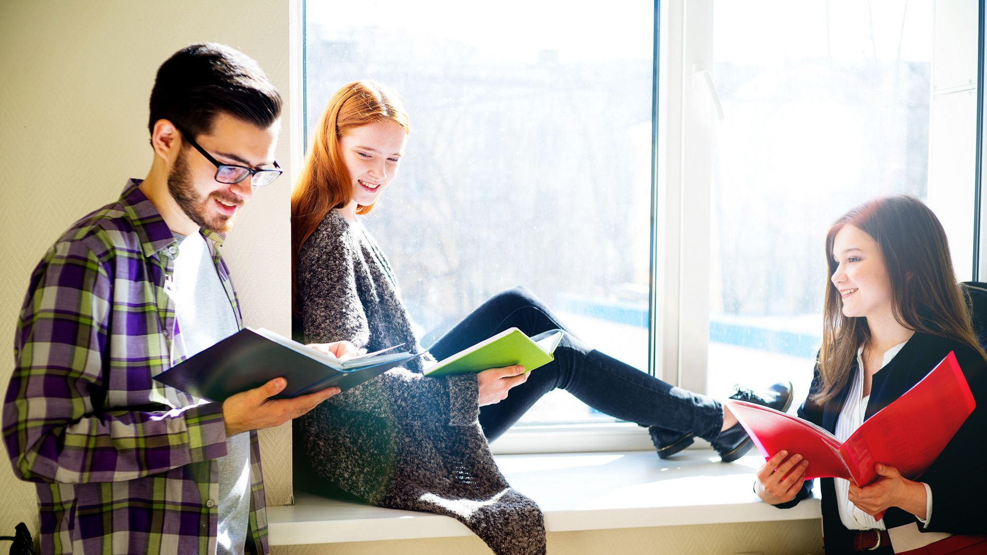 Three students reading together